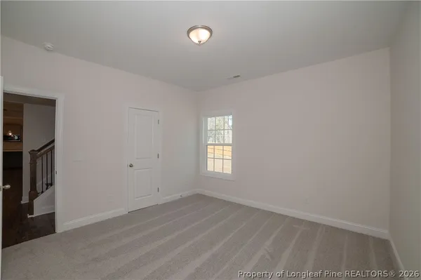 a bathroom with a sink a light fixture and a mirror