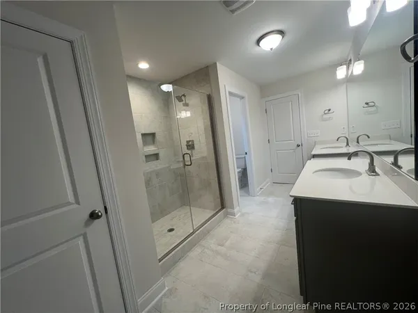 a bathroom with sink and mirror