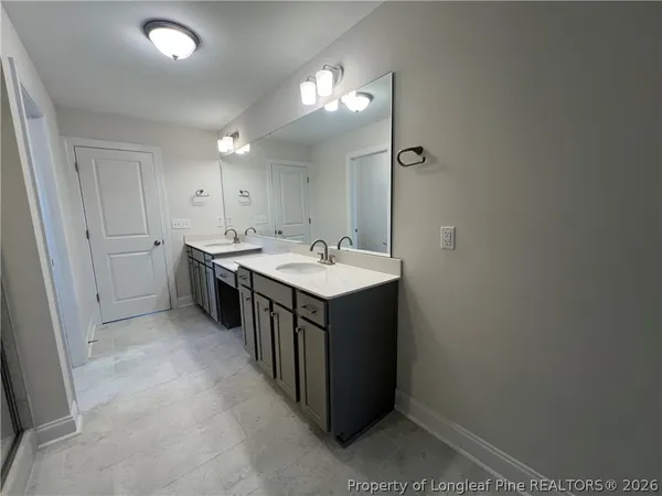 a utility room with a sink a washer and dryer