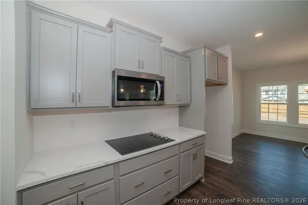 a view of hallway with wooden floor