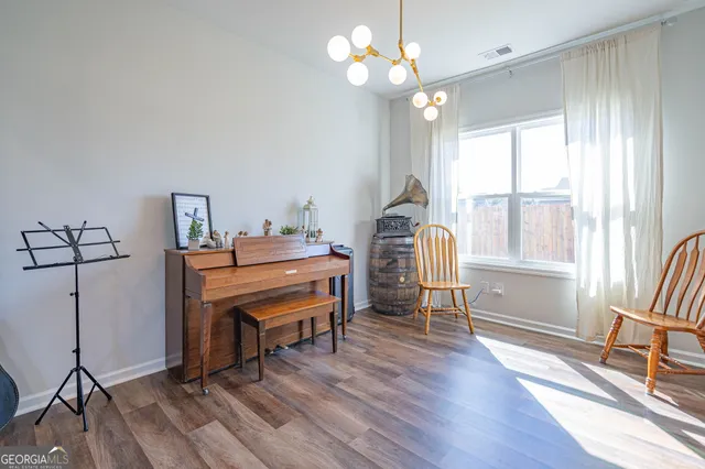 a view of a room with furniture window and wooden floor