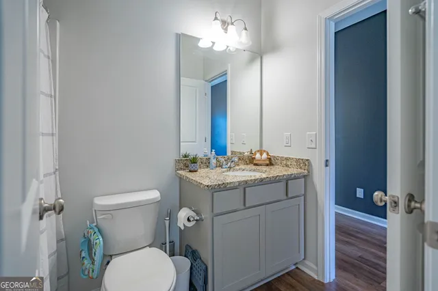 a bedroom with two beds and a table