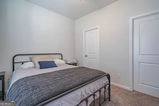 a front view of house with yard and lake