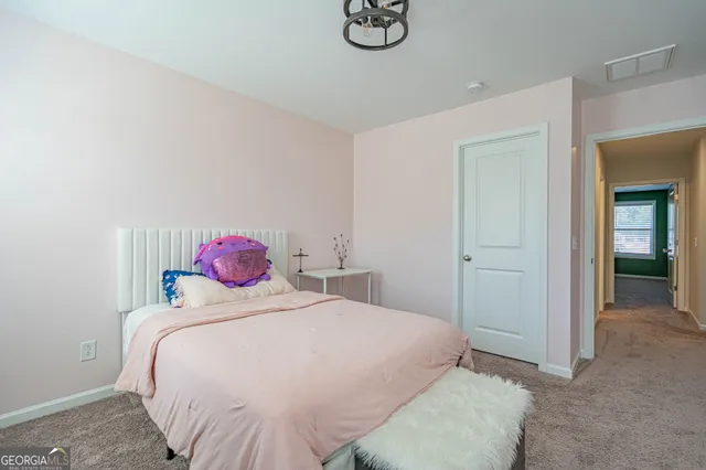 a living room with furniture a couch and a window