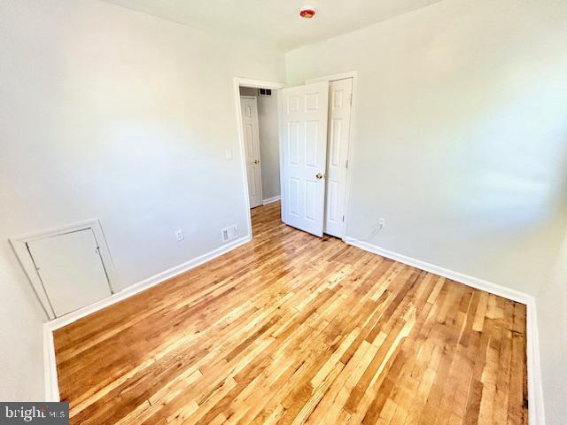 8405 12th Avenue Silver Spring, MD 20903 - Photo 19 of 23 Bright and airy bedroom with hardwood floors.
