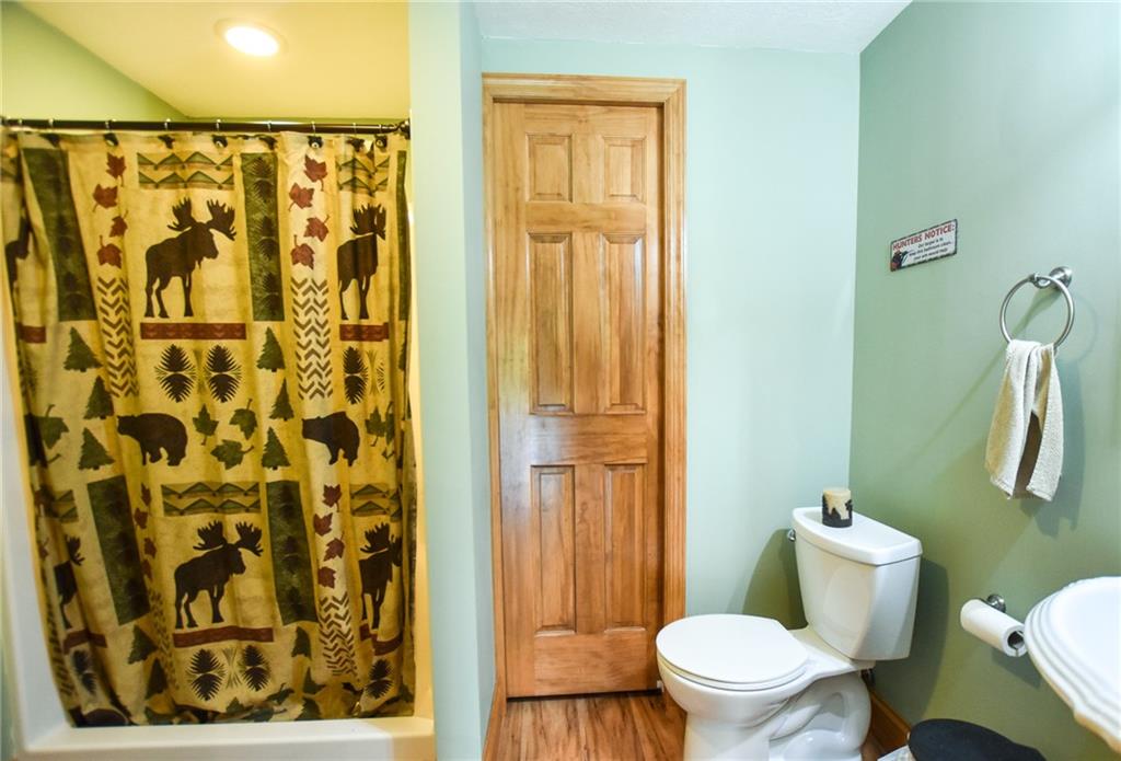 252 Becker Road Butler, PA 16002 - Photo 19 of 23 a white toilet sitting next to a bathroom