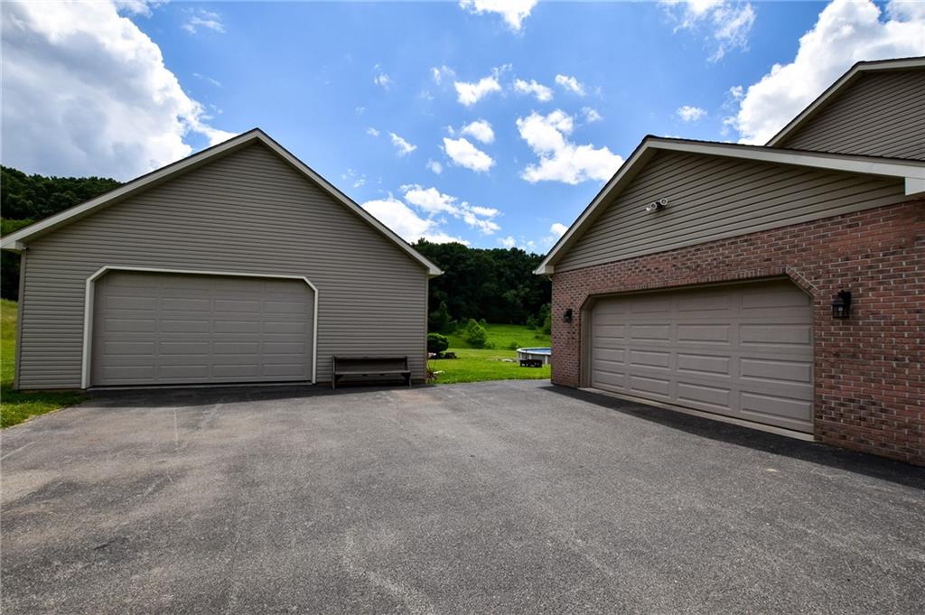 252 Becker Road Butler, PA 16002 - Photo 3 of 23 a view of a house with a garage