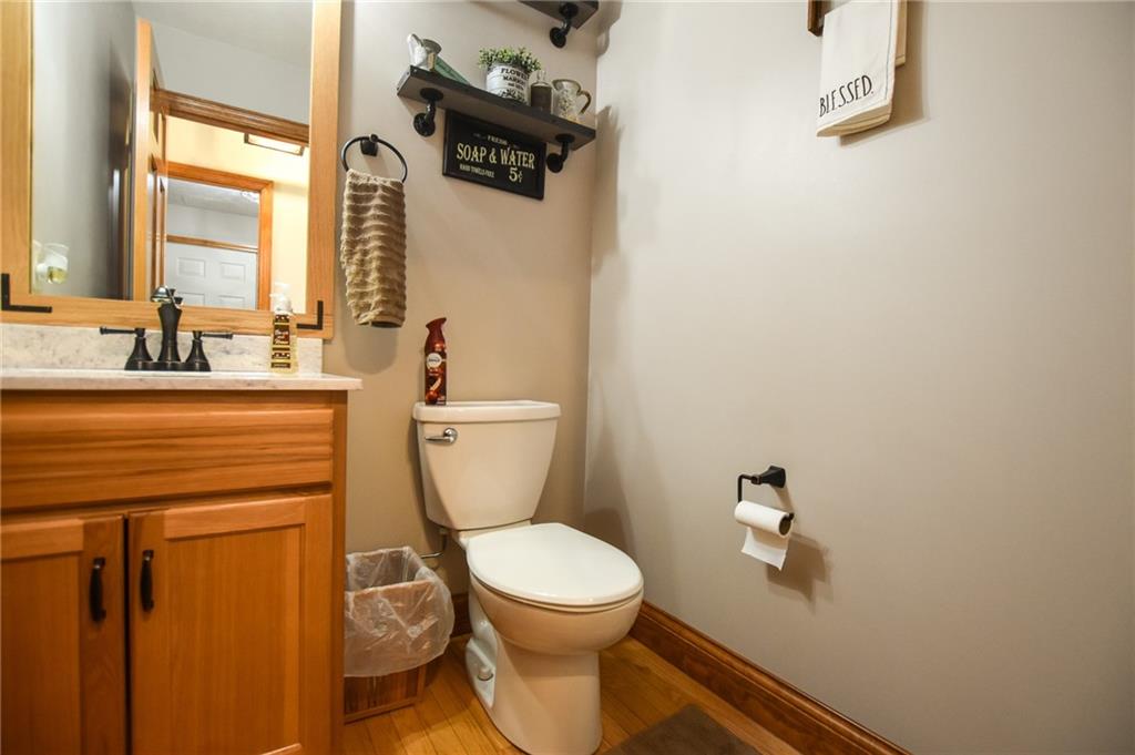 252 Becker Road Butler, PA 16002 - Photo 10 of 23 a bathroom with a toilet a sink and mirror