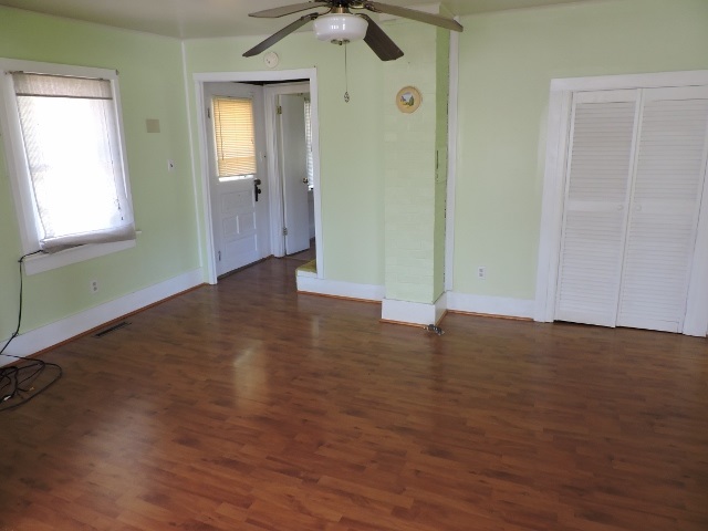 684 Lea Port Road Verona, VA 24482 - Photo 3 of 20 an empty room with wooden floor and windows