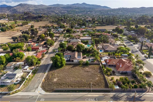 an aerial view of residential house and car parked