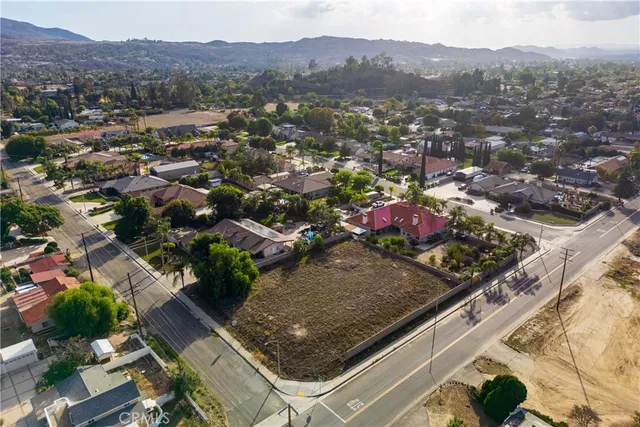 an aerial view of residential houses and city view