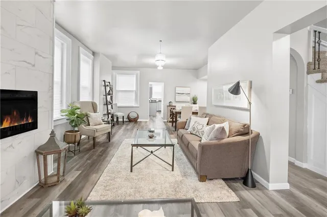 a living room with furniture and a fireplace
