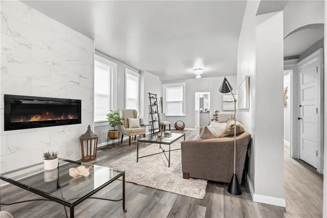 a living room with furniture and a flat screen tv