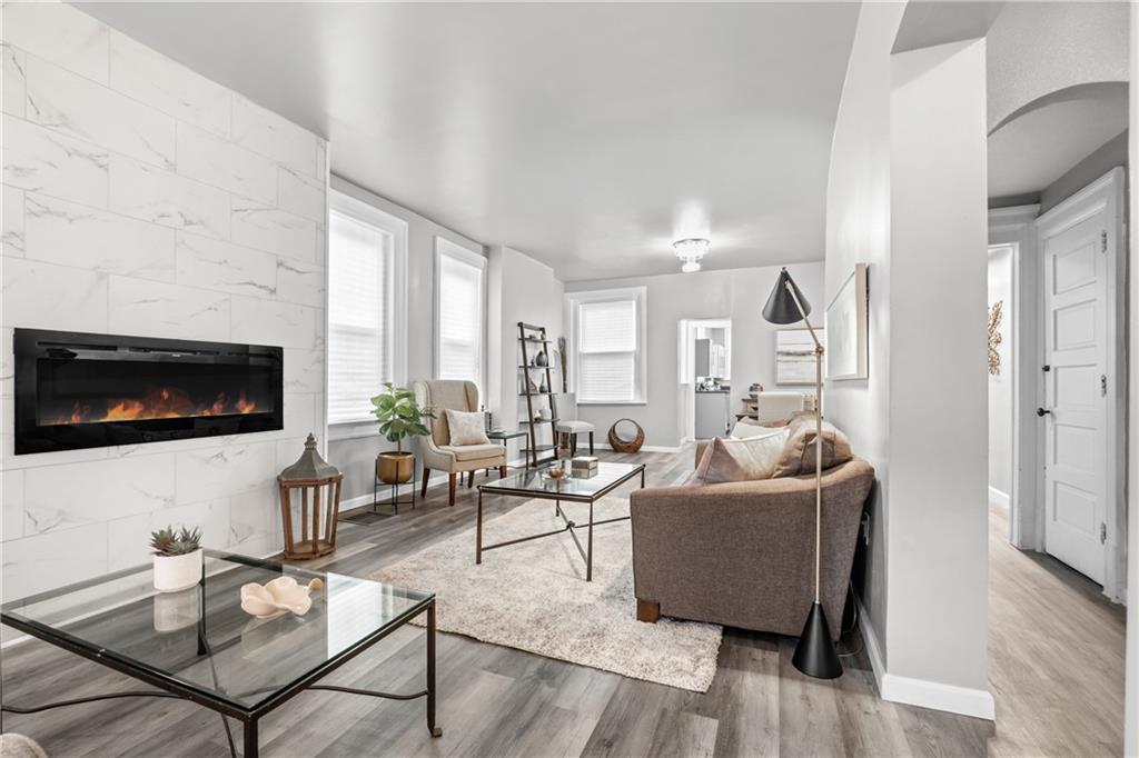 1256 Superior Avenue Pittsburgh, PA 15212 - Photo 13 of 50 a living room with furniture and a flat screen tv