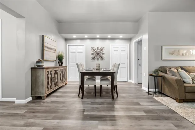 a view of a dining room with furniture and window