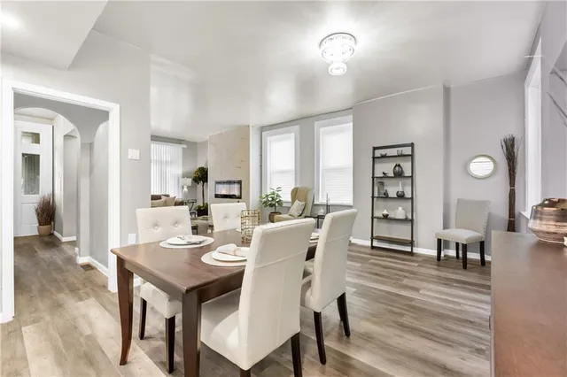 a view of a dining room with furniture and wooden floor