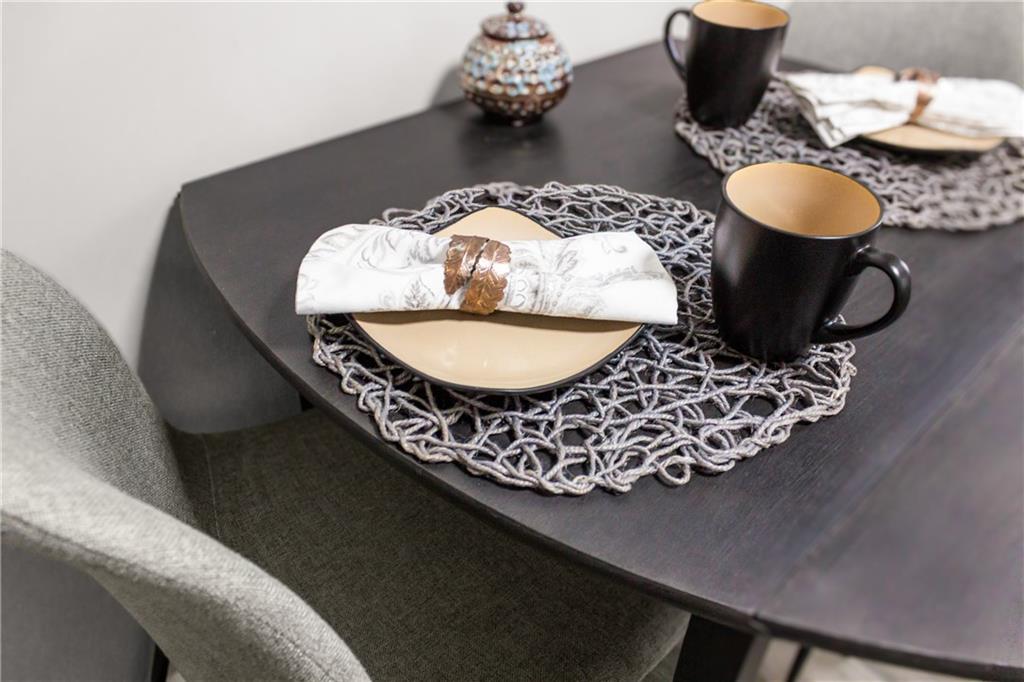 1256 Superior Avenue Pittsburgh, PA 15212 - Photo 27 of 50 a table with chairs and a vase of books on it