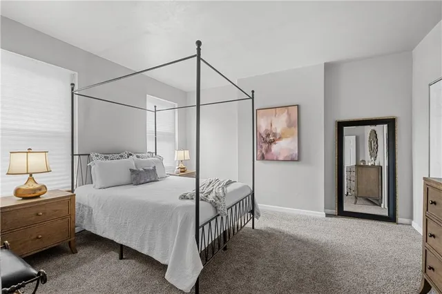 a bedroom with a bed and ceiling fan