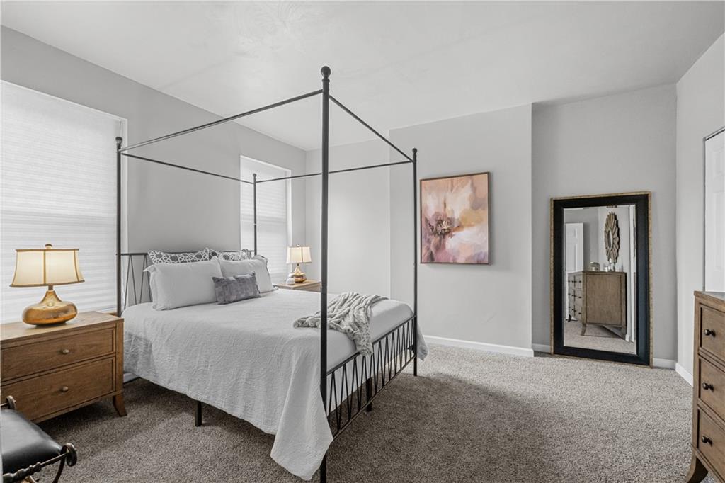 1256 Superior Avenue Pittsburgh, PA 15212 - Photo 35 of 50 a bedroom with a bed and ceiling fan