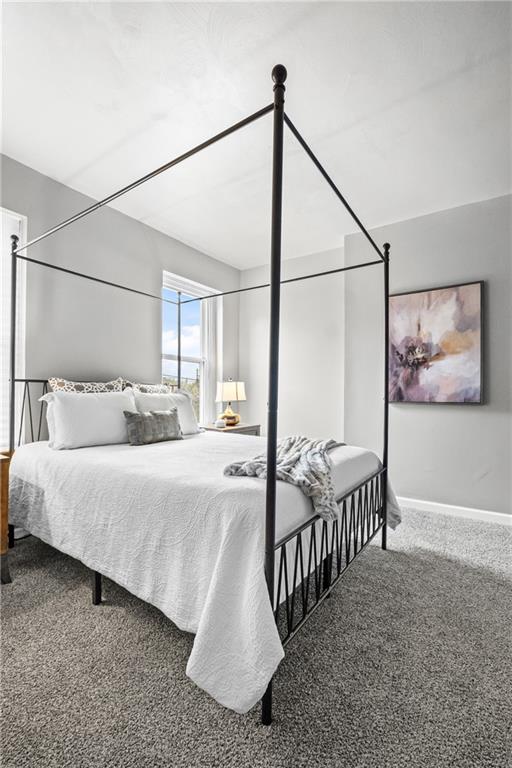 1256 Superior Avenue Pittsburgh, PA 15212 - Photo 37 of 50 a bedroom with three beds and a chandelier