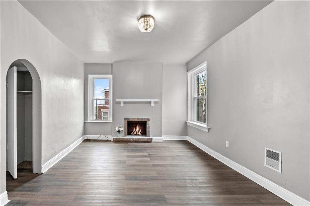 1256 Superior Avenue Pittsburgh, PA 15212 - Photo 40 of 50 a view of empty room with fireplace and wooden floor