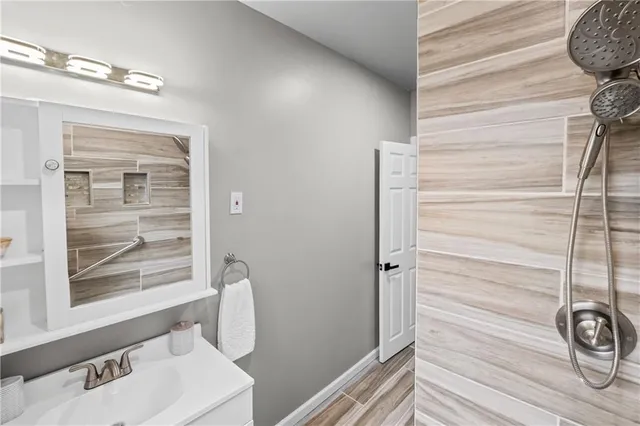 a bathroom with a bathtub and a shower