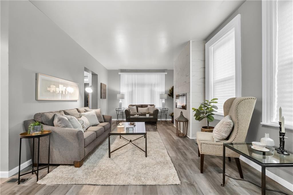 1256 Superior Avenue Pittsburgh, PA 15212 - Photo 5 of 50 a living room with furniture and a potted plant on a table