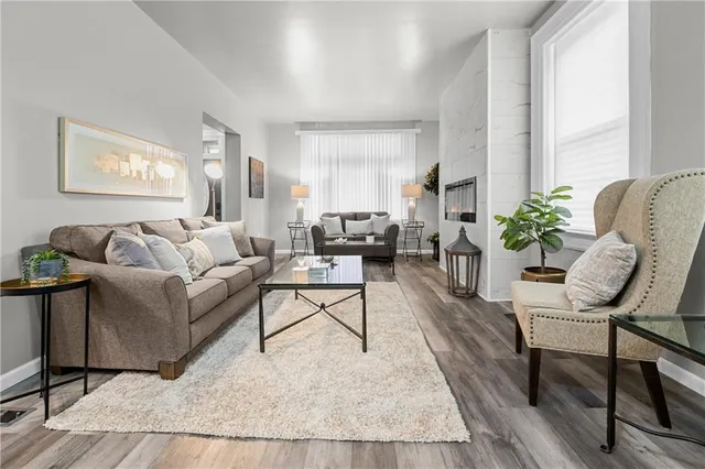 a living room with furniture and a large window