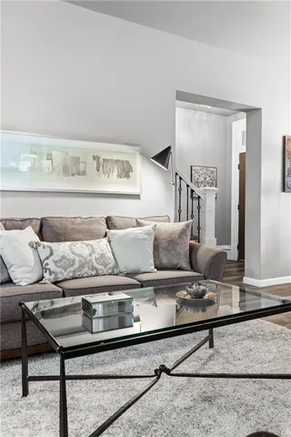 a living room with furniture and a rug