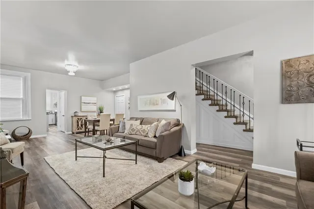 a living room with furniture and a table