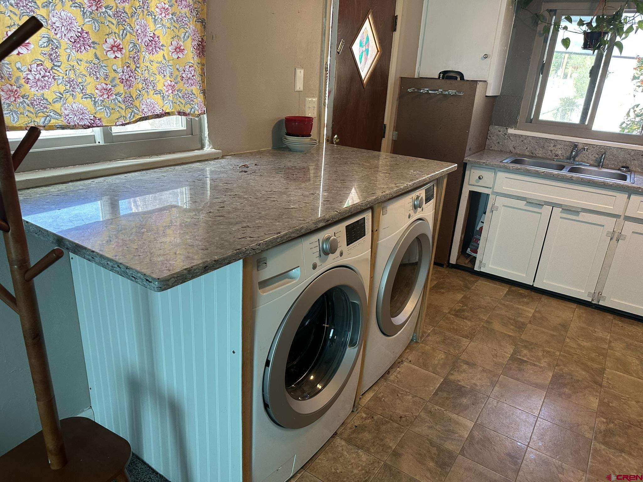 435 South Elm Street Cortez, CO 81321 - Photo 3 of 17 a utility room with dryer and washer