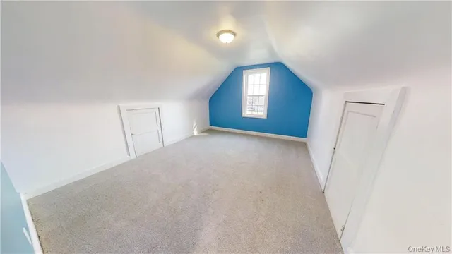 a view of a room that has a window in it