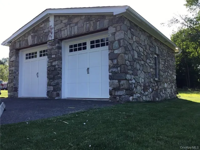 a view of an house with backyard space and garden
