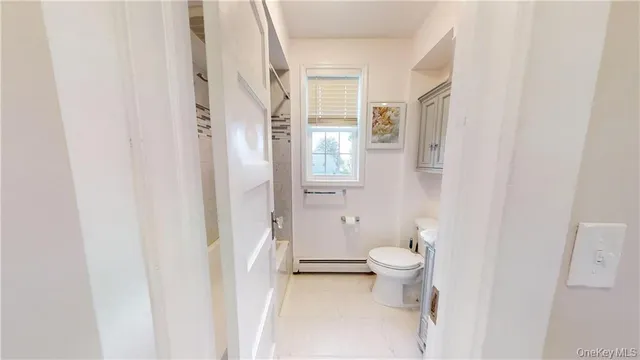 a bathroom with a toilet and a sink