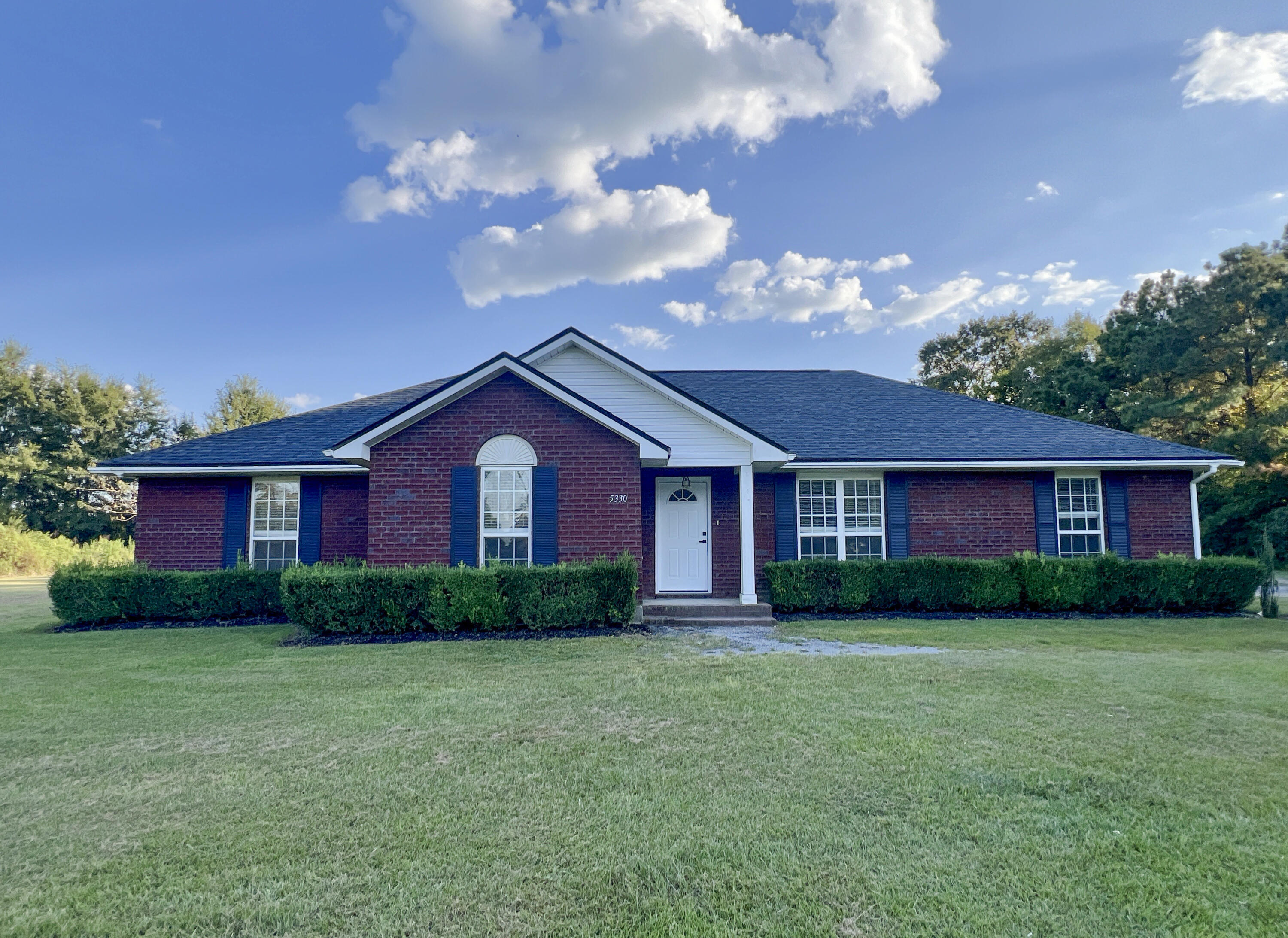 a house view with a garden space
