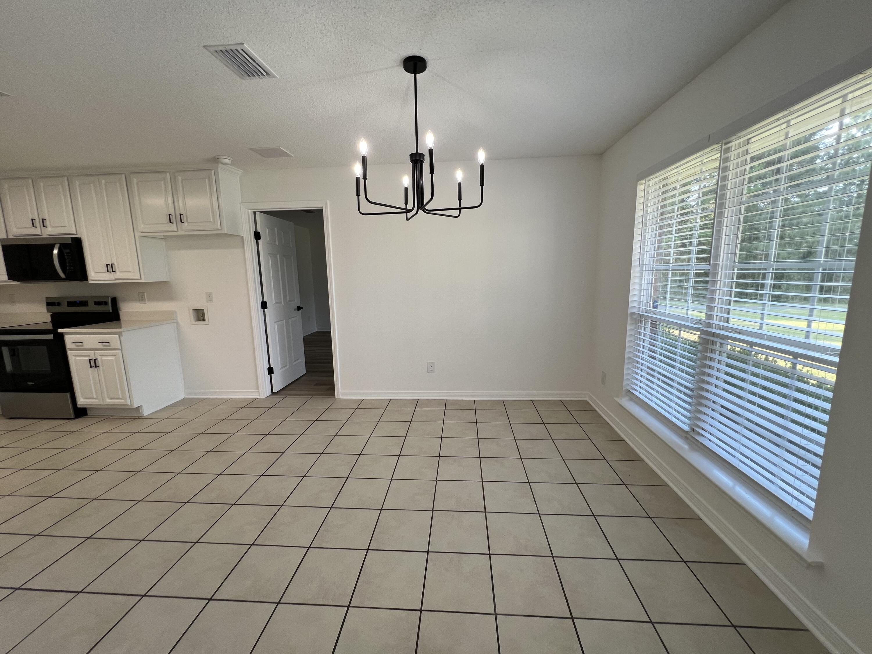 5330 John Lowery Road Jay, FL 32565 - Photo 14 of 30 a very nice looking room with a large window