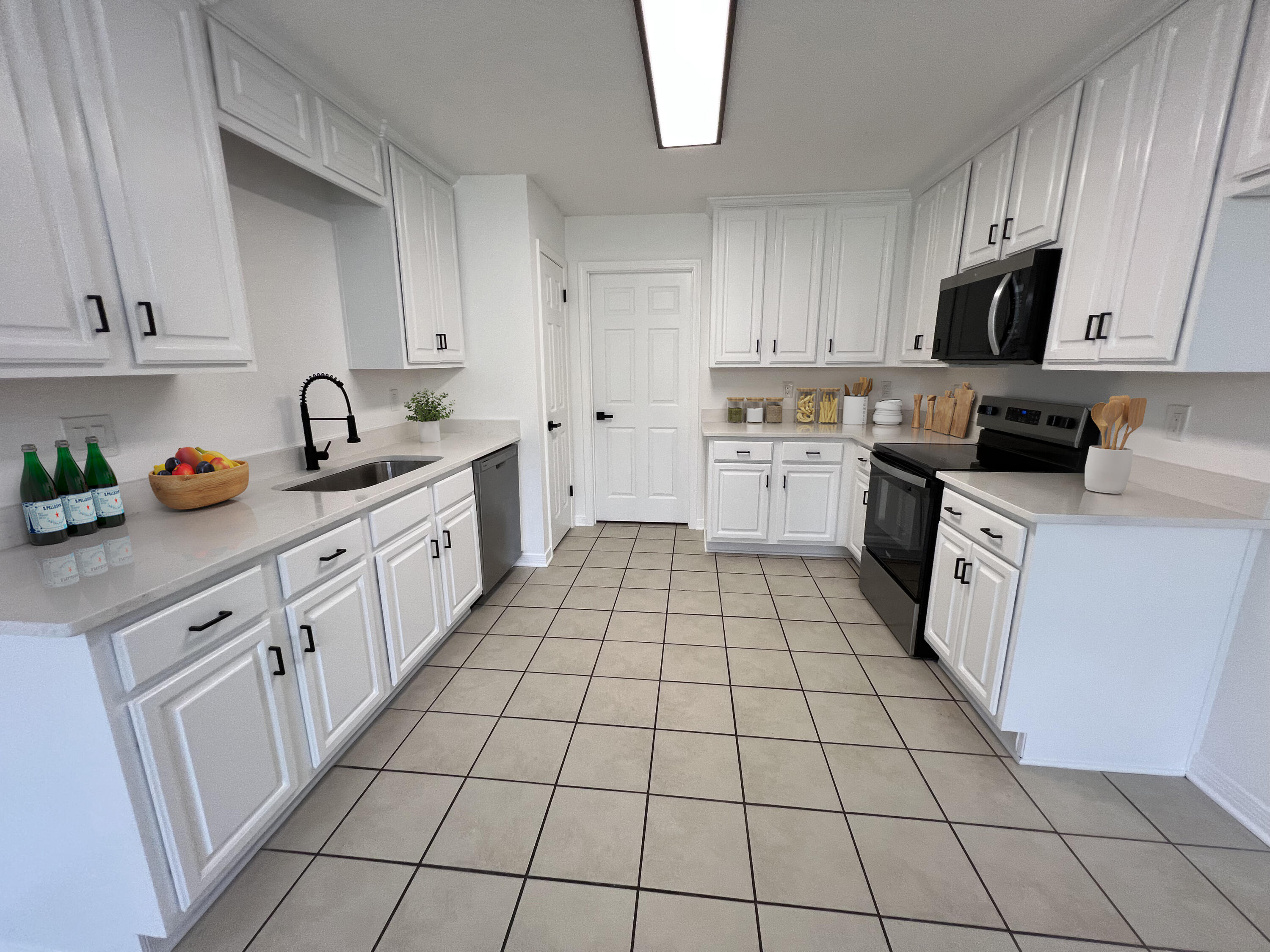 5330 John Lowery Road Jay, FL 32565 - Photo 18 of 30 a kitchen with a sink a stove top oven and cabinets