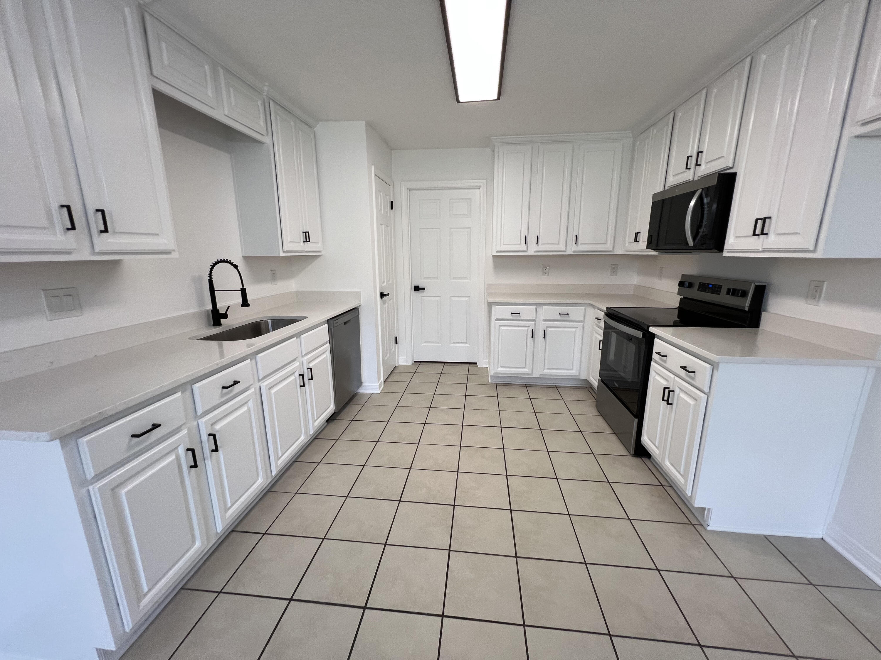 5330 John Lowery Road Jay, FL 32565 - Photo 19 of 30 a kitchen with a sink dishwasher stove and cabinets