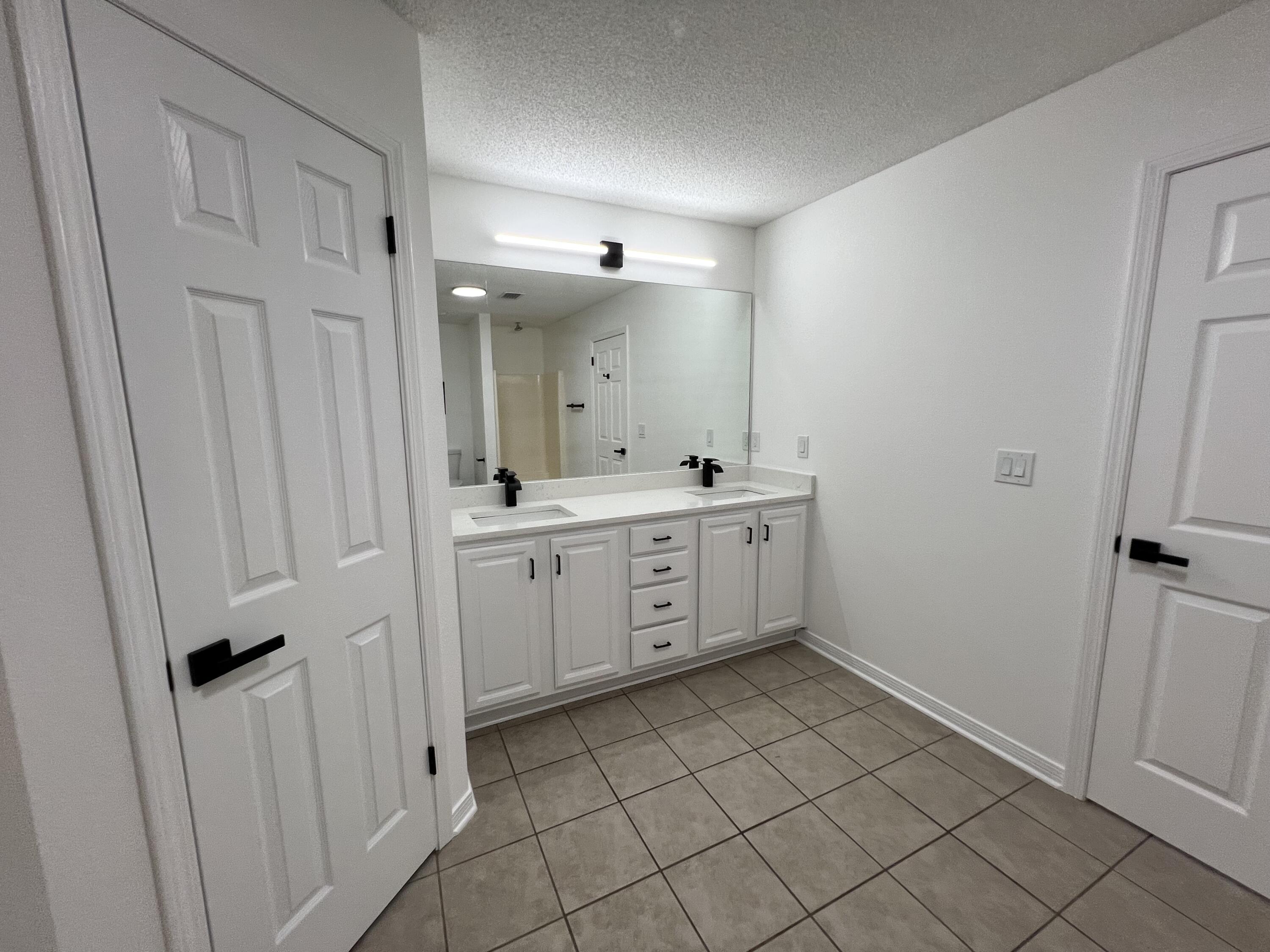 5330 John Lowery Road Jay, FL 32565 - Photo 22 of 30 a bathroom with a sink a toilet and mirror