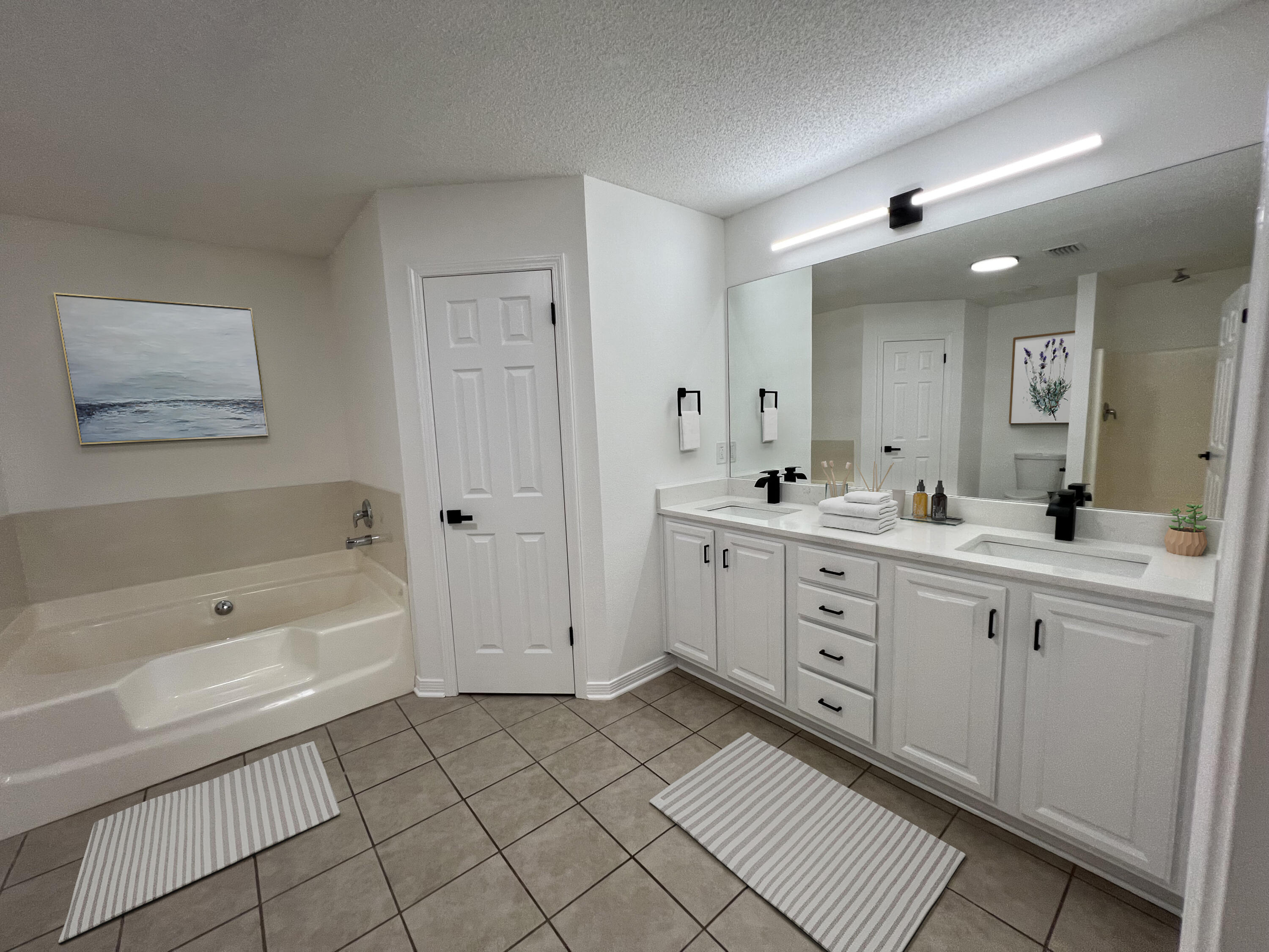 5330 John Lowery Road Jay, FL 32565 - Photo 25 of 30 a spacious bathroom with a double vanity sink mirror and bathtub