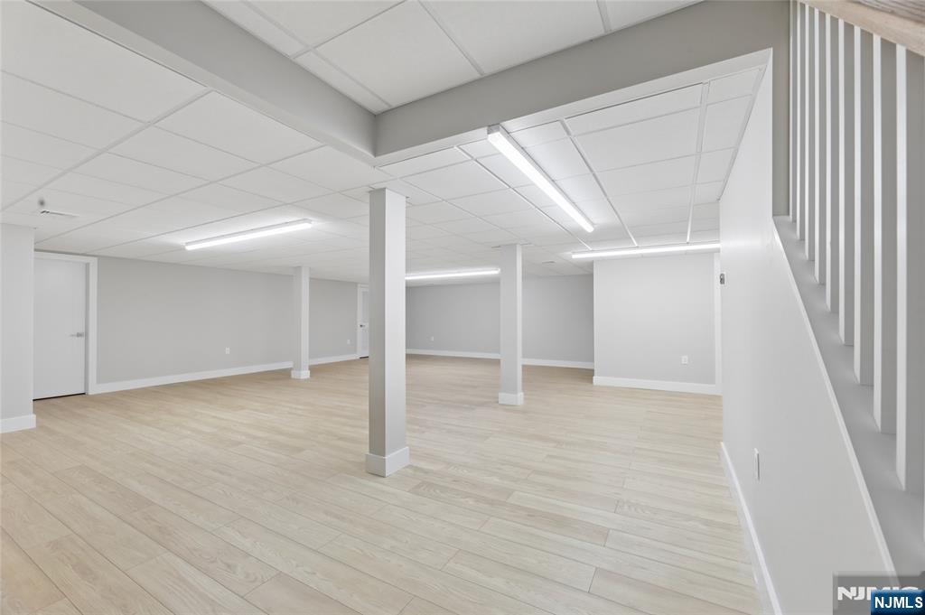 31 Engleside Street Cresskill, NJ 07626 - Photo 39 of 49 an empty room with wooden floor and windows