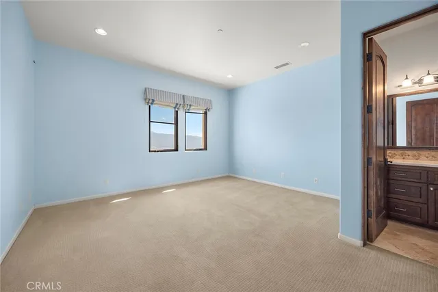 a view of a big room with windows and cabinet