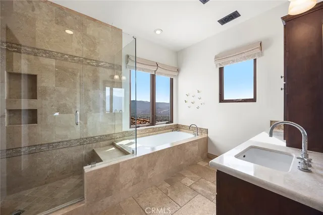 a bathroom with a bathtub and a shower