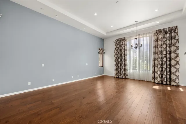 a spacious bathroom with a granite countertop sink a mirror a vanity and shower