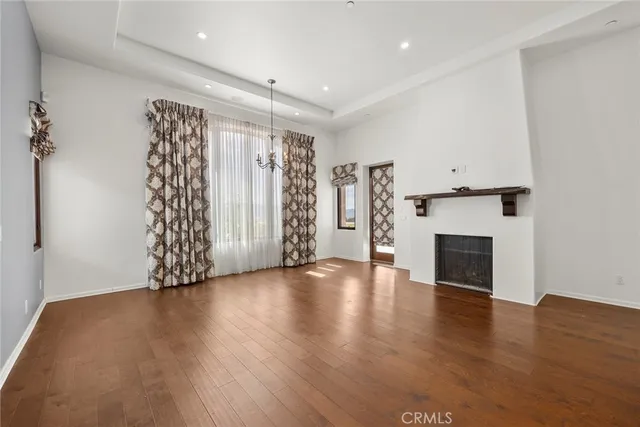 a bathroom with a granite countertop sink a large mirror and a bathtub
