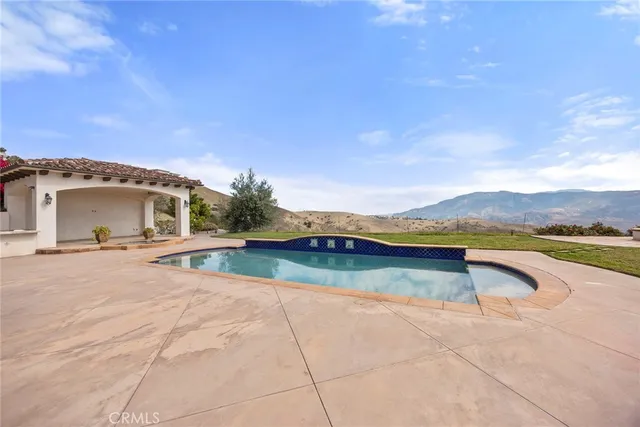 a view of swimming pool from a balcony