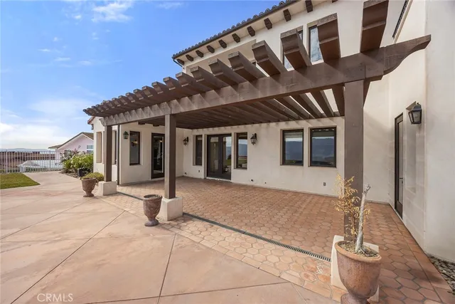 an aerial view of multiple houses with a lake view