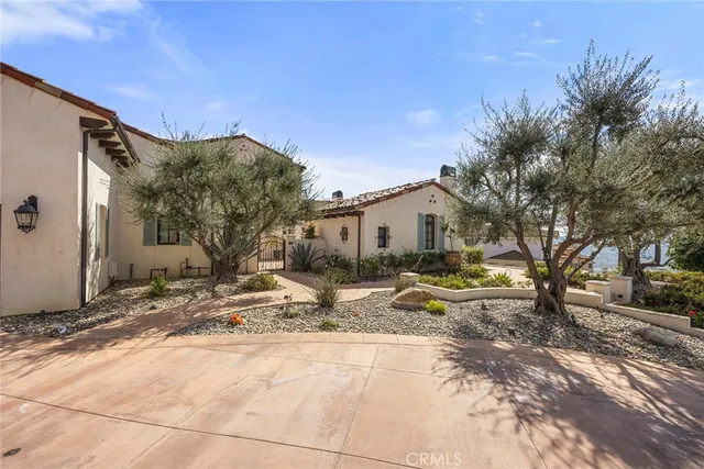 a view of a house with snow on the road