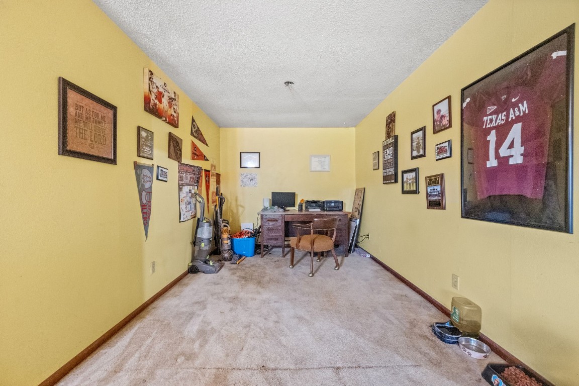 71 Shady Oaks Point Blank, TX 77364 - Photo 13 of 32 a bed room with furniture and paintings on the wall
