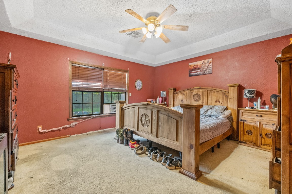 71 Shady Oaks Point Blank, TX 77364 - Photo 14 of 32 a white bed sitting in a room next to a window